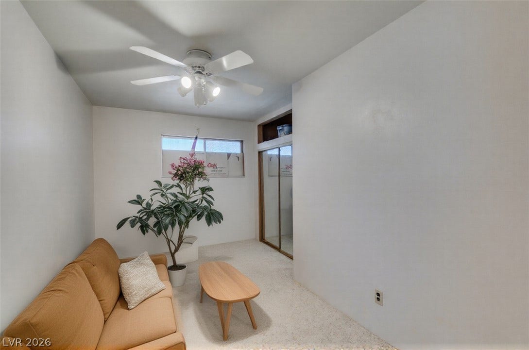 661 Burton Street, Henderson, NV 89015 A versatile upstairs storage room #4 highlights clean white walls and durable textured carpeting.