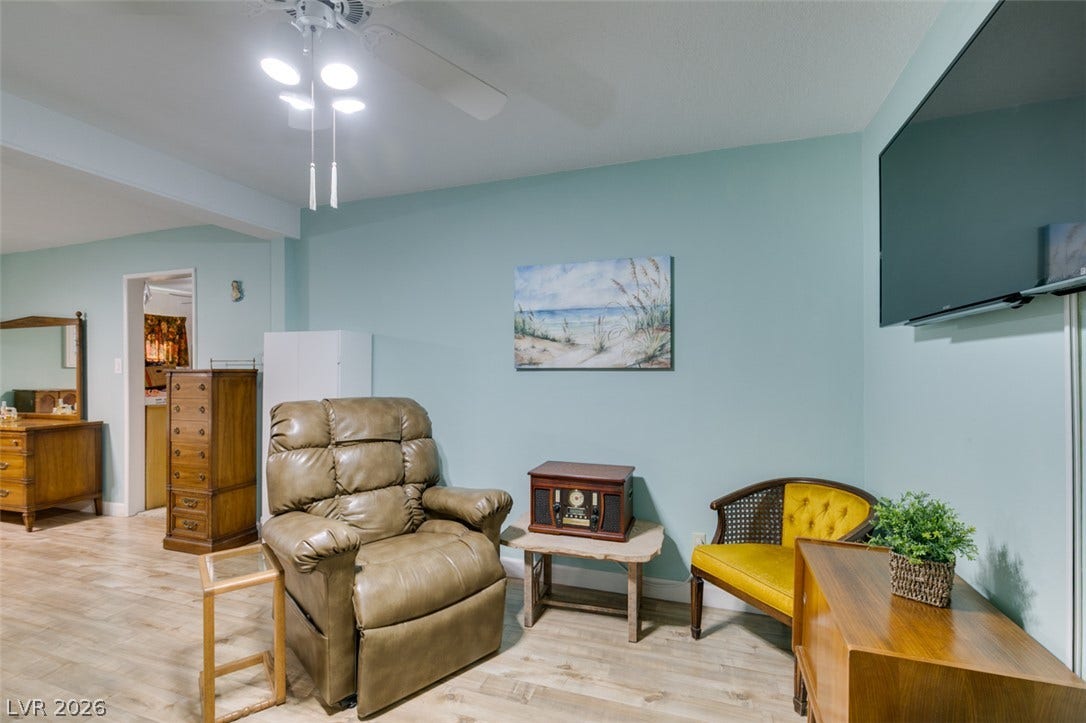 661 Burton Street, Henderson, NV 89015 Smooth wood-look flooring and clean lines define this comfortable living area.