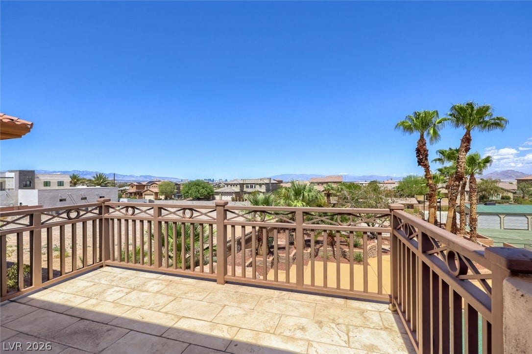 2807 Richmar Avenue, Henderson, NV 89074 Panoramic mountain and neighborhood views extend from this stone-paved upper balcony.