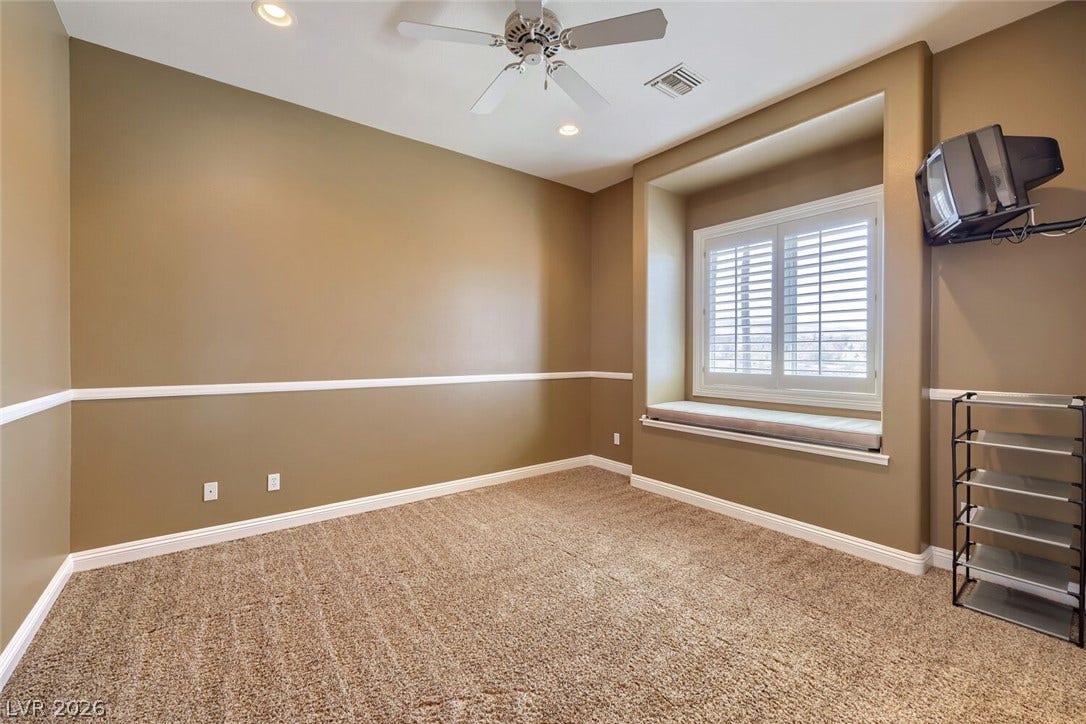 2807 Richmar Avenue, Henderson, NV 89074 Chair rail molding and a deep window seat define this versatile interior space.