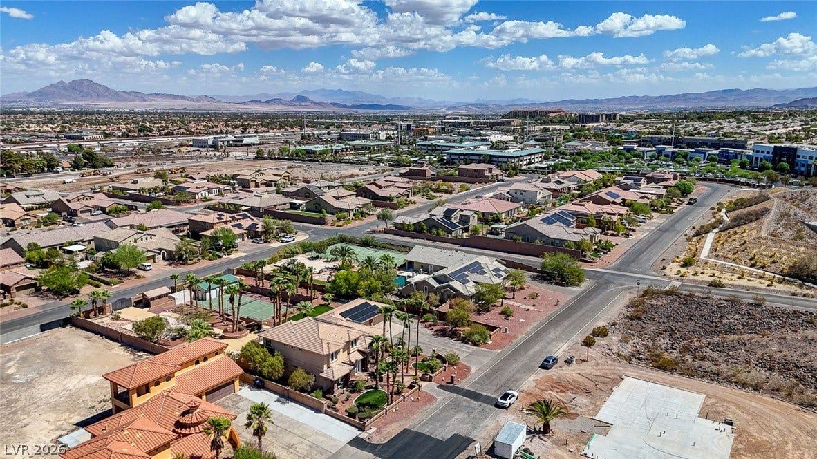 2807 Richmar Avenue, Henderson, NV 89074 Distant mountains frame a sweeping aerial perspective of this quiet desert neighborhood.