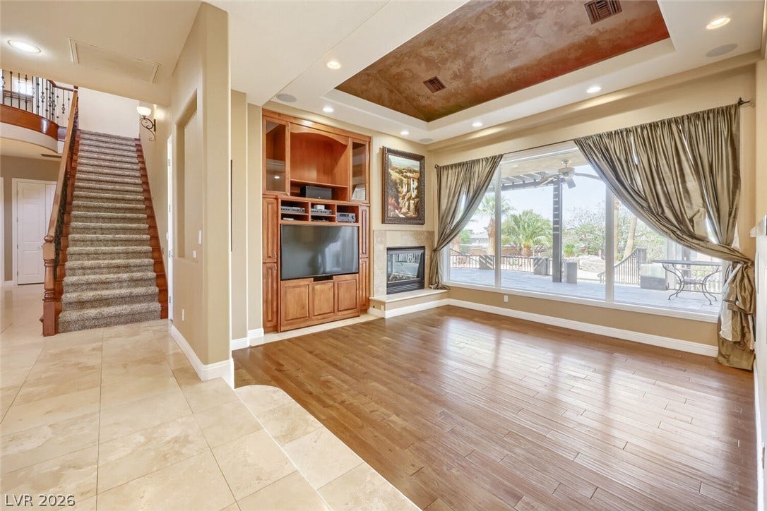 2807 Richmar Avenue, Henderson, NV 89074 Gleaming hardwood floors and a recessed ceiling accent define this elegant living area.