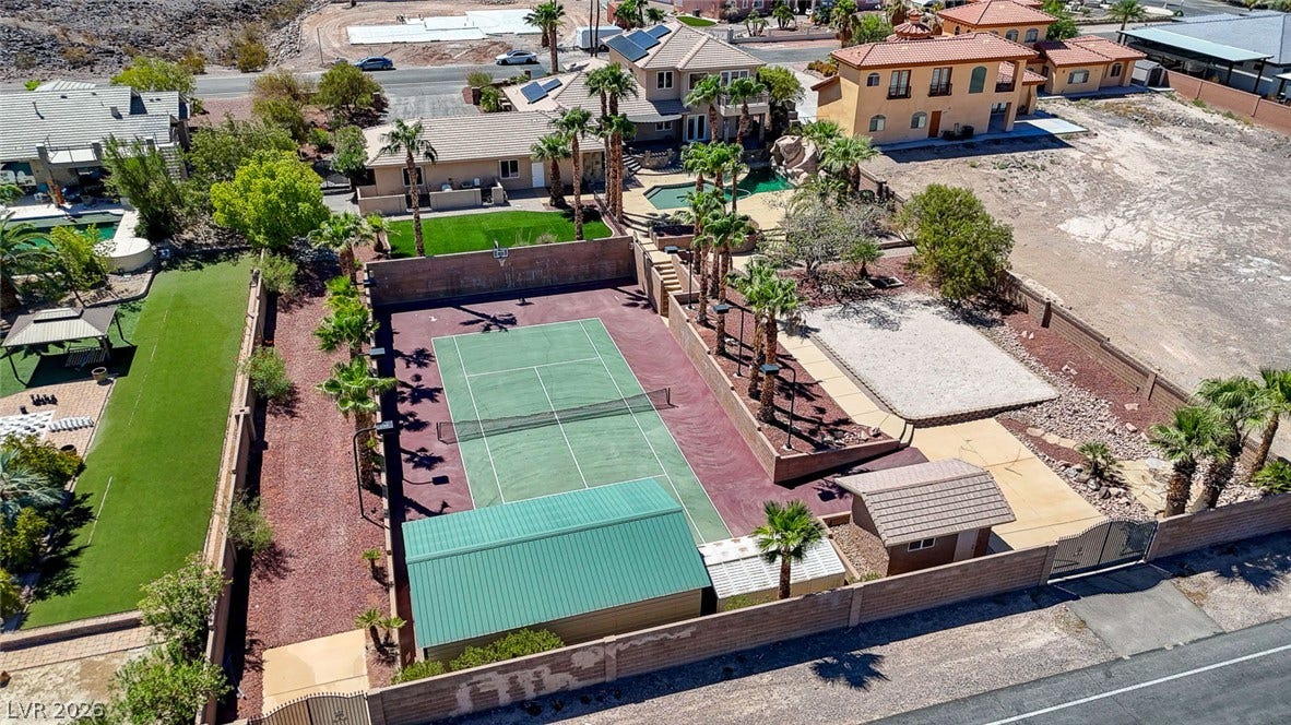 2807 Richmar Avenue, Henderson, NV 89074 A private tennis court and detached storage buildings highlight the backyard of this property.