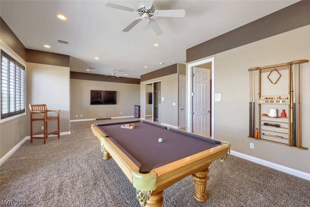 2807 Richmar Avenue, Henderson, NV 89074 Plush carpeting anchors this expansive recreation room framed by structured crown molding details.