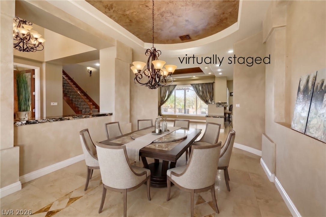 2807 Richmar Avenue, Henderson, NV 89074 Gleaming tile floors and a soaring tray ceiling elevate this elegant formal dining room.