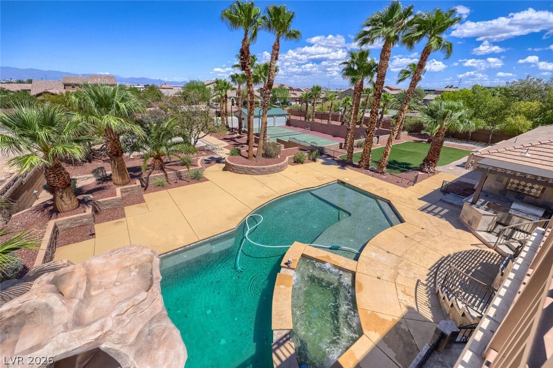 2807 Richmar Avenue, Henderson, NV 89074 A sparkling in-ground pool and integrated spa anchor this private desert backyard oasis.