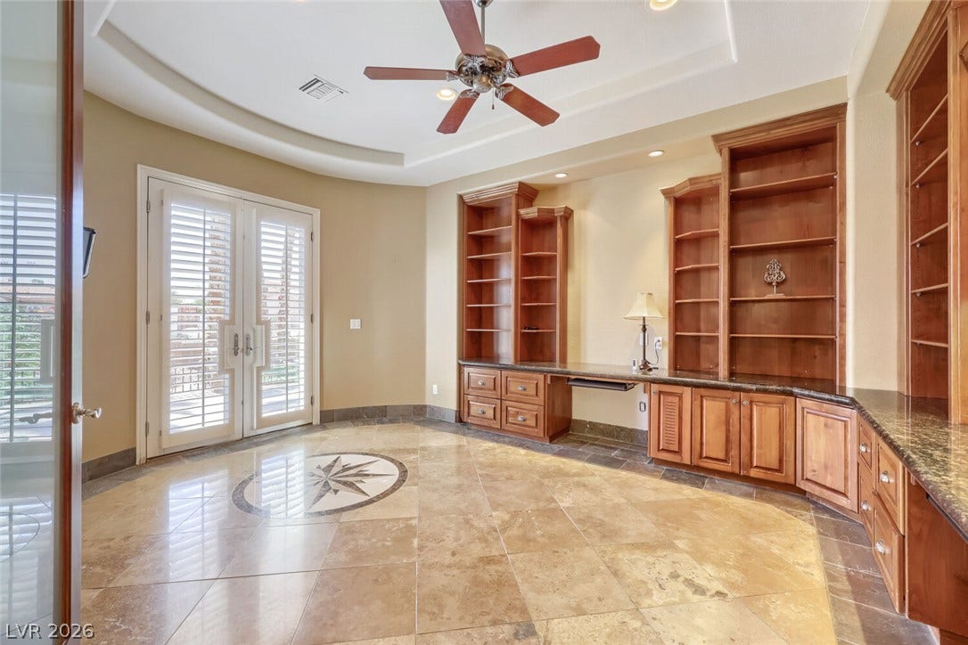 2807 Richmar Avenue, Henderson, NV 89074 Rich built-in cabinetry and stone tile flooring define this quiet home office space.