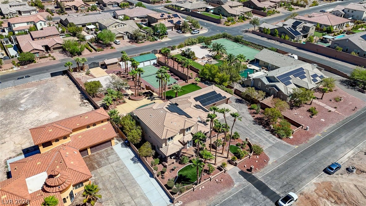 2807 Richmar Avenue, Henderson, NV 89074 An aerial perspective captures this desert landscape featuring tile roofing and integrated solar panels.
