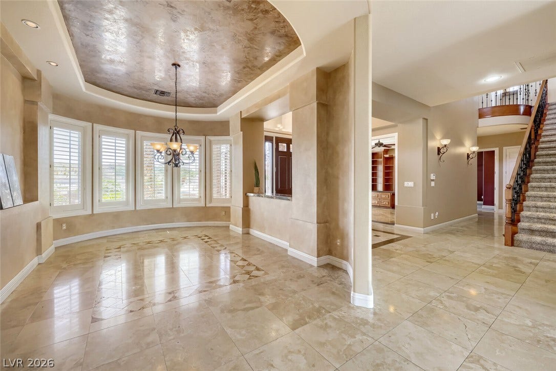 2807 Richmar Avenue, Henderson, NV 89074 Polished tile flooring and an ornate tray ceiling define this grand, open entryway.