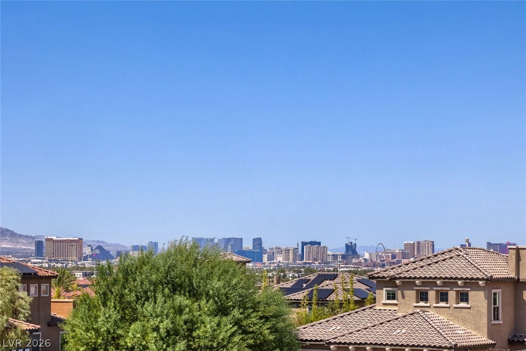 2807 Richmar Avenue, Henderson, NV 89074 Gaze across the valley toward the sparkling city skyline and surrounding mountain ranges.