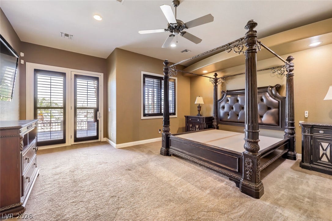 2807 Richmar Avenue, Henderson, NV 89074 Glass doors open to outdoor space, highlighting this plushly carpeted bedroom with recessed lighting.