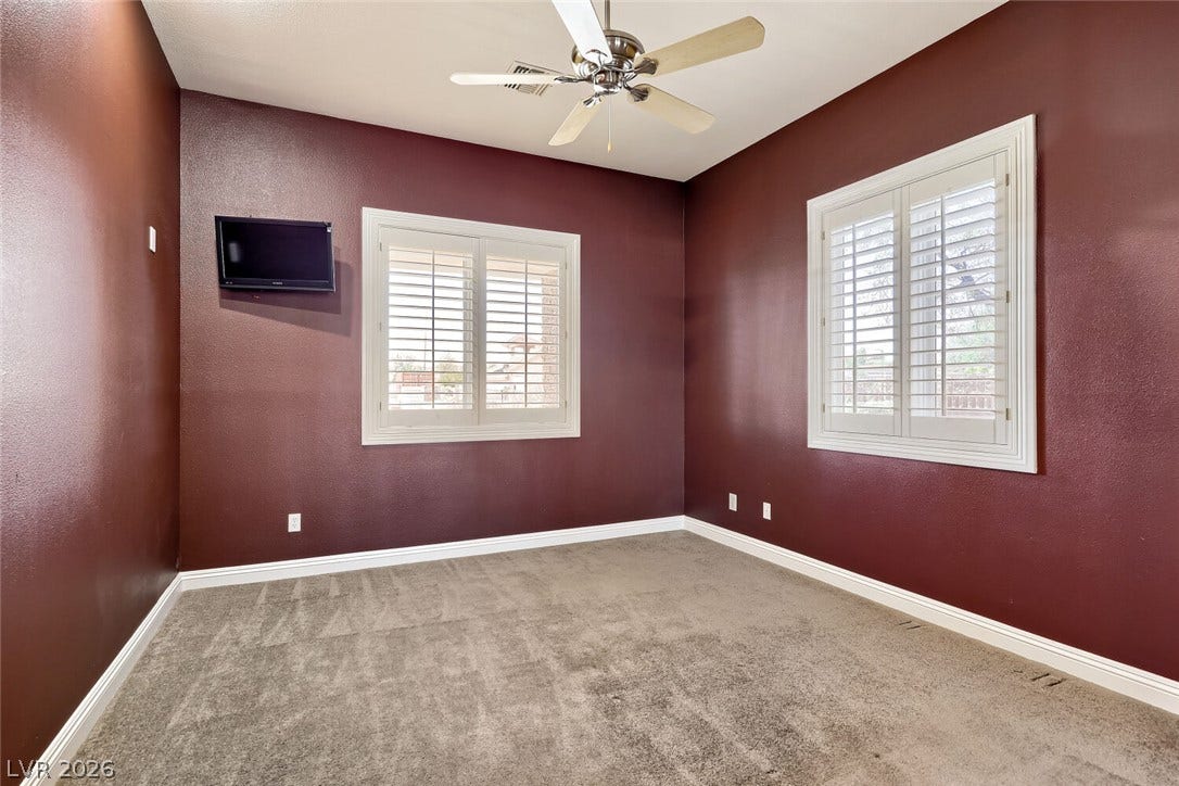 2807 Richmar Avenue, Henderson, NV 89074 Crisp white shutters contrast beautifully with rich wall tones over comfortable carpeted flooring.