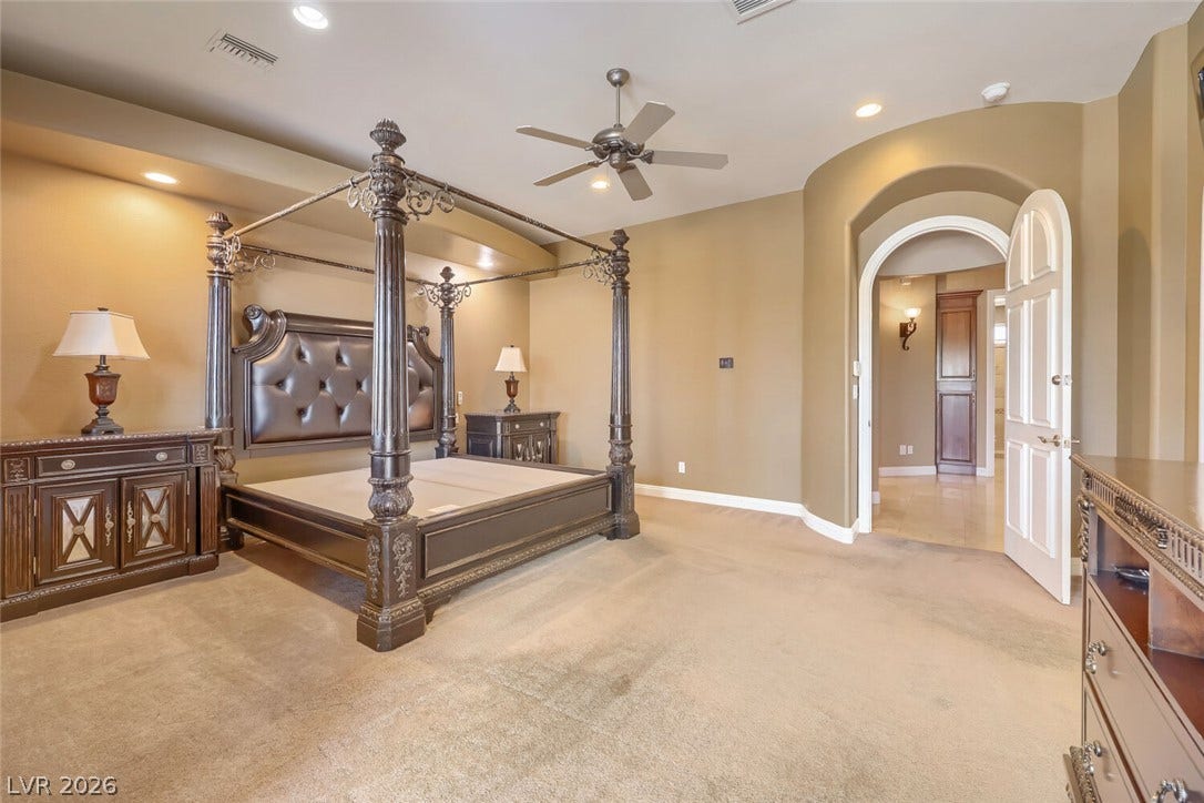 2807 Richmar Avenue, Henderson, NV 89074 An arched doorway opens to this generous main suite featuring recessed lighting and plush carpeting.