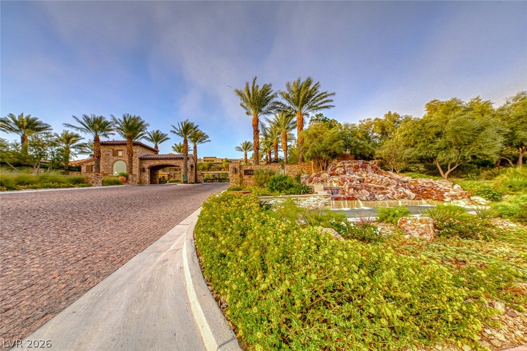 41 Moltrasio Lane, Henderson, NV 89011 A stone guard gate and cascading waterfall feature welcome residents to this exclusive community.