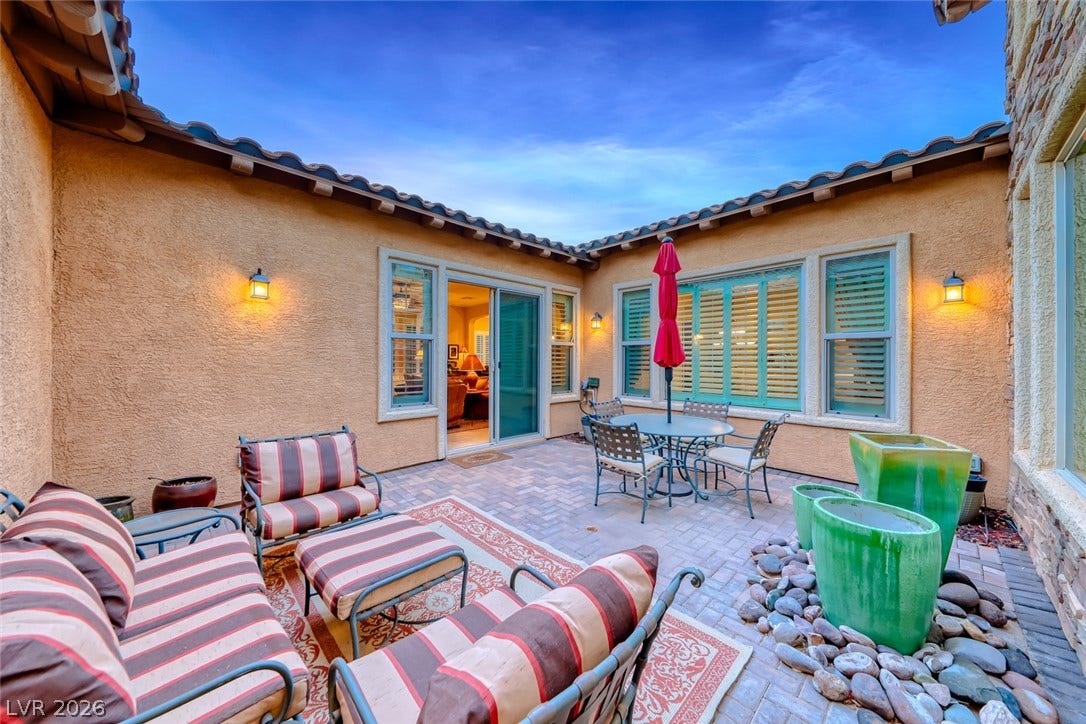41 Moltrasio Lane, Henderson, NV 89011 An inviting stone-paved courtyard is enclosed by stucco walls and a classic tiled roofline.