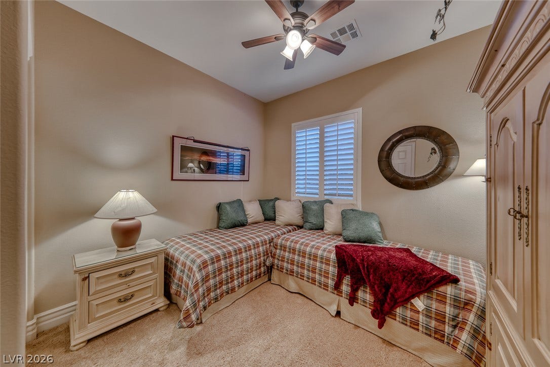 41 Moltrasio Lane, Henderson, NV 89011 High ceilings and soft carpeting create a cozy atmosphere in this quiet secondary bedroom.