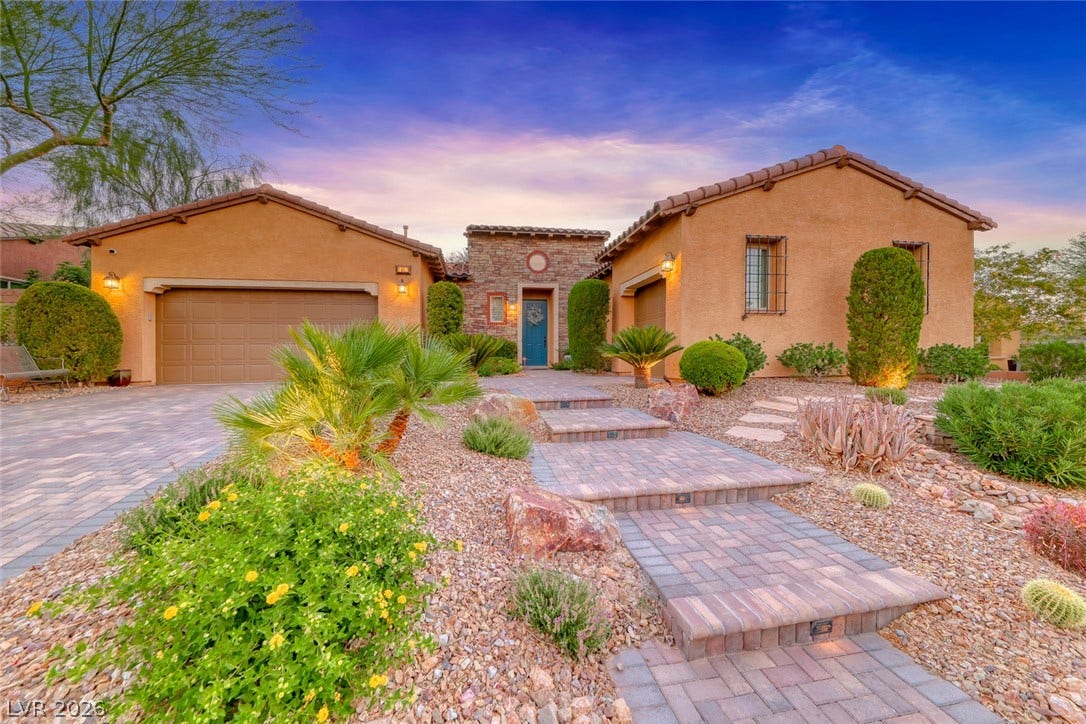 41 Moltrasio Lane, Henderson, NV 89011 Desert landscaping and a paved walkway lead to this beautiful southwestern-style home.