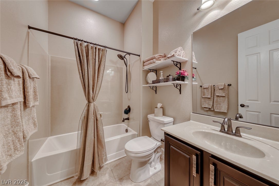 41 Moltrasio Lane, Henderson, NV 89011 High ceilings and neutral finishes define this comfortable bathroom.