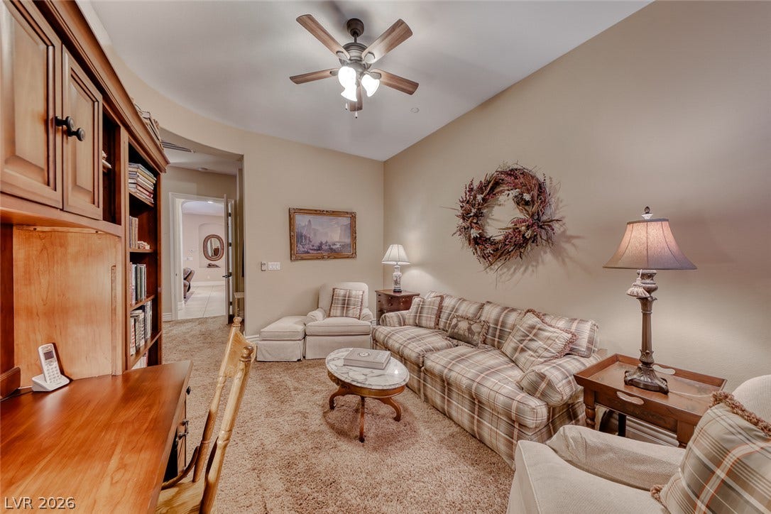 41 Moltrasio Lane, Henderson, NV 89011 A built-in desk and matching shelving units optimize space in this cozy carpeted den.