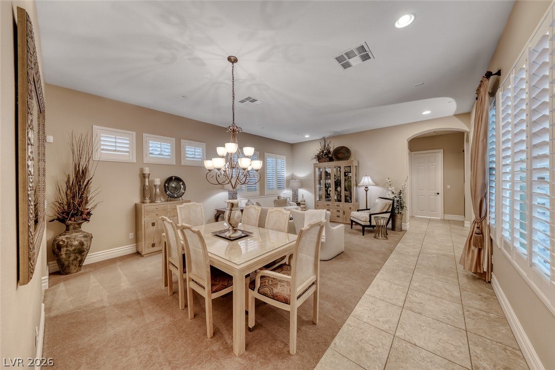 41 Moltrasio Lane, Henderson, NV 89011 A spacious formal dining area flow seamlessly into the adjacent living space.