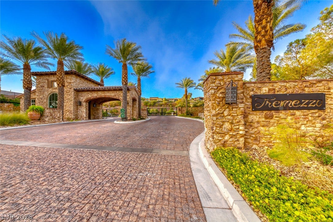 41 Moltrasio Lane, Henderson, NV 89011 An elegant stone entry gate welcomes residents home along a beautifully paved driveway.