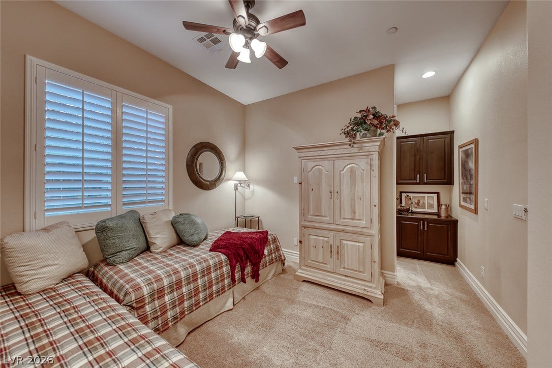 41 Moltrasio Lane, Henderson, NV 89011 High ceilings and plantation shutters bring a classic architectural quality to this comfortable bedroom space.