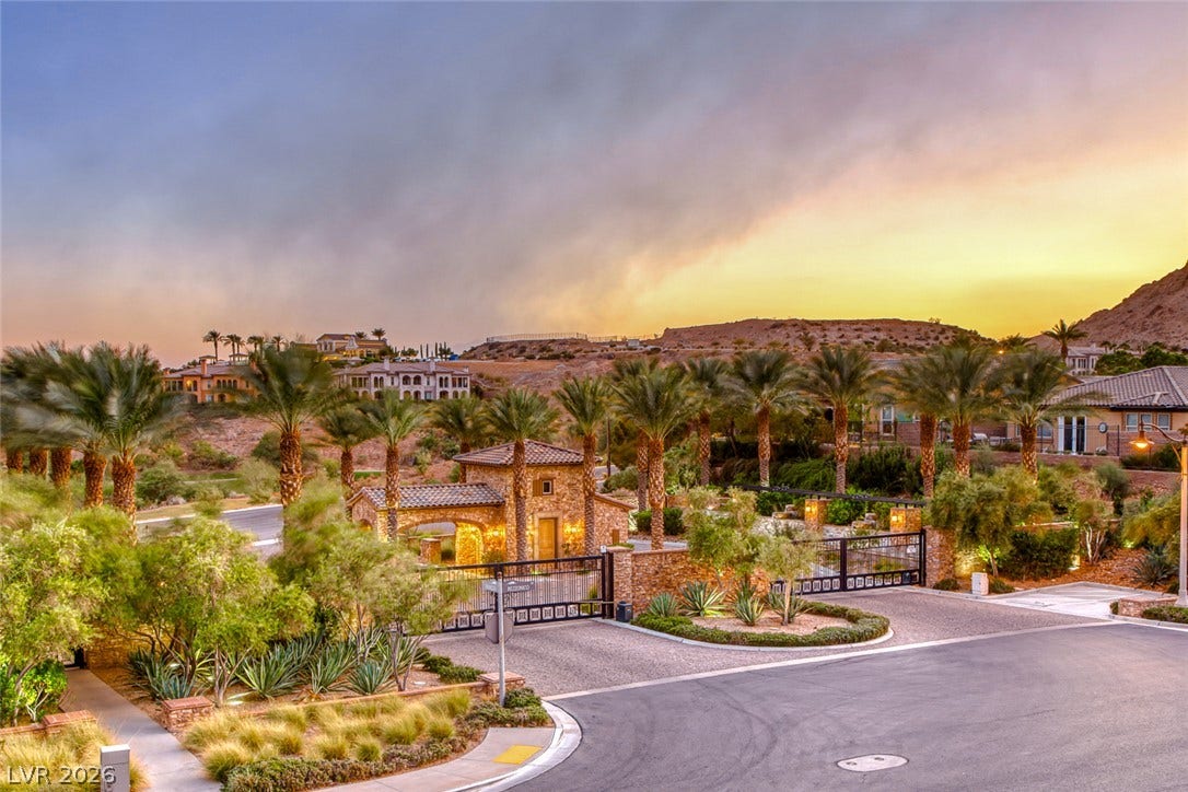 41 Moltrasio Lane, Henderson, NV 89011 A secure gated entrance leads into this exclusive desert community surrounded by palm trees.