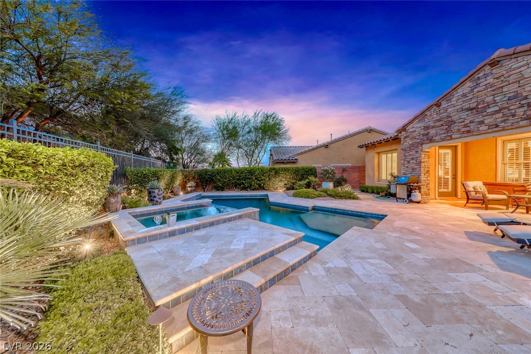 41 Moltrasio Lane, Henderson, NV 89011 An inviting backyard pool and spa are bordered by stone accents and extensive paving.
