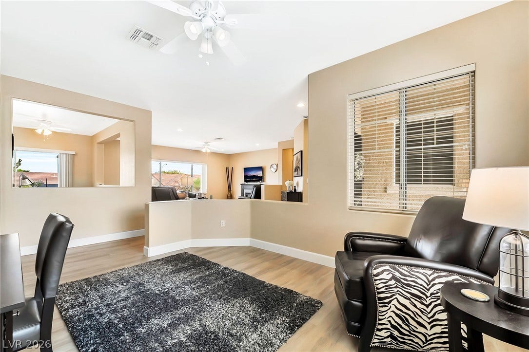 An open floor plan connects the versatile living spaces, highlighted by clean lines and modern flooring.