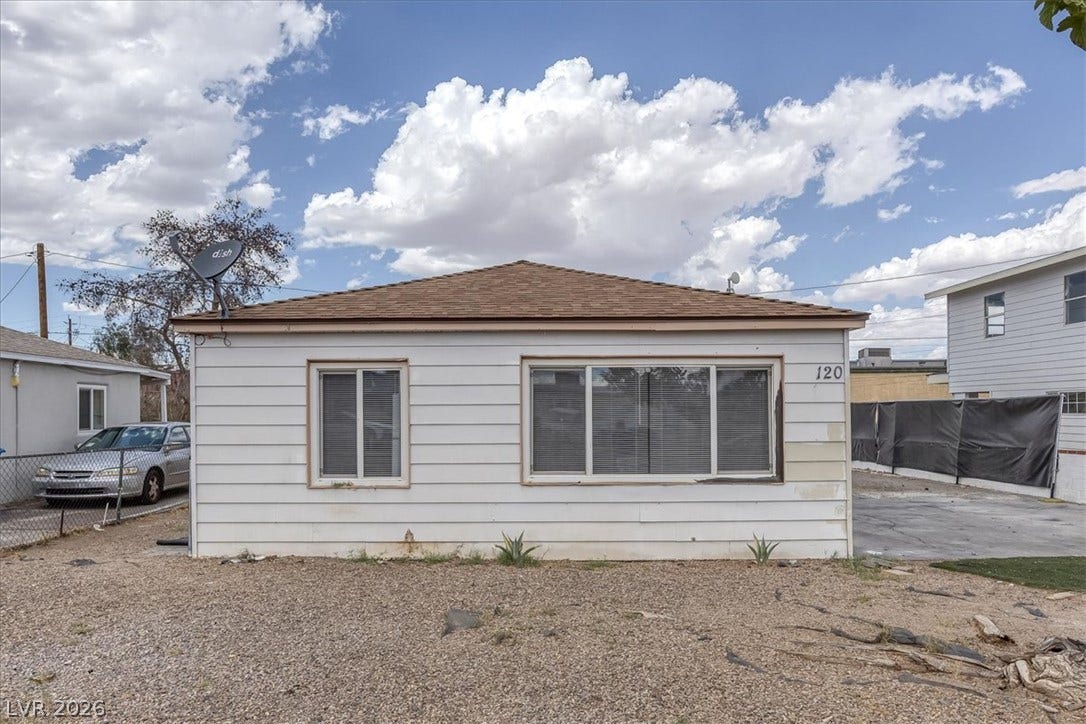 120 W Victory Road, Henderson, NV 89015 Classic horizontal siding and a clean roofline define this single-story structure under open skies.