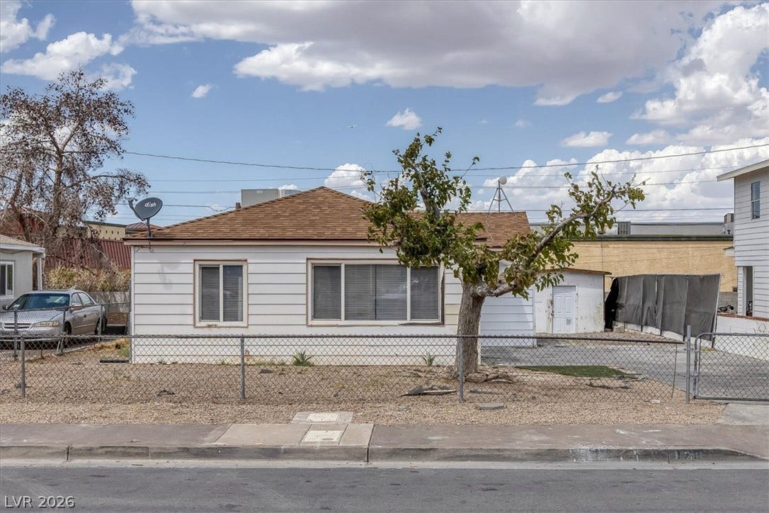 120 W Victory Road, Henderson, NV 89015 Classic horizontal siding and a traditional shingle roof define this single-level home's exterior character.