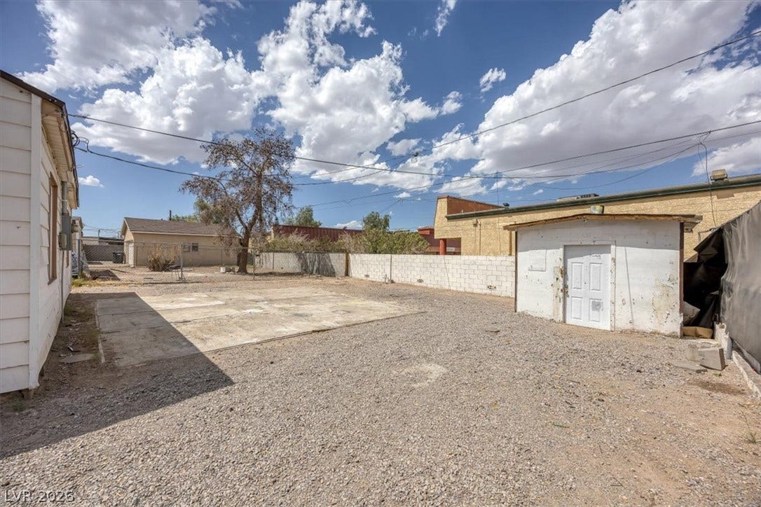 120 W Victory Road, Henderson, NV 89015 An expansive gravel yard features concrete pads and a versatile detached storage shed.
