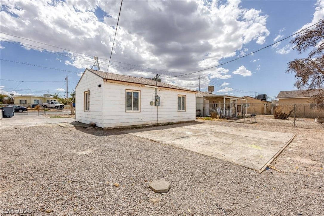 120 W Victory Road, Henderson, NV 89015 A spacious gravel lot and a concrete pad provide ample outdoor space under wide skies.