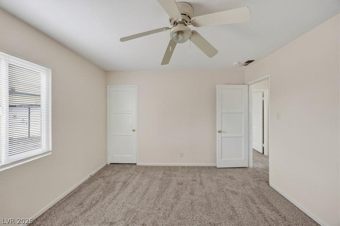 120 W Victory Road, Henderson, NV 89015 Soft carpeting underfoot defines this comfortable room complete with classic panel doors.