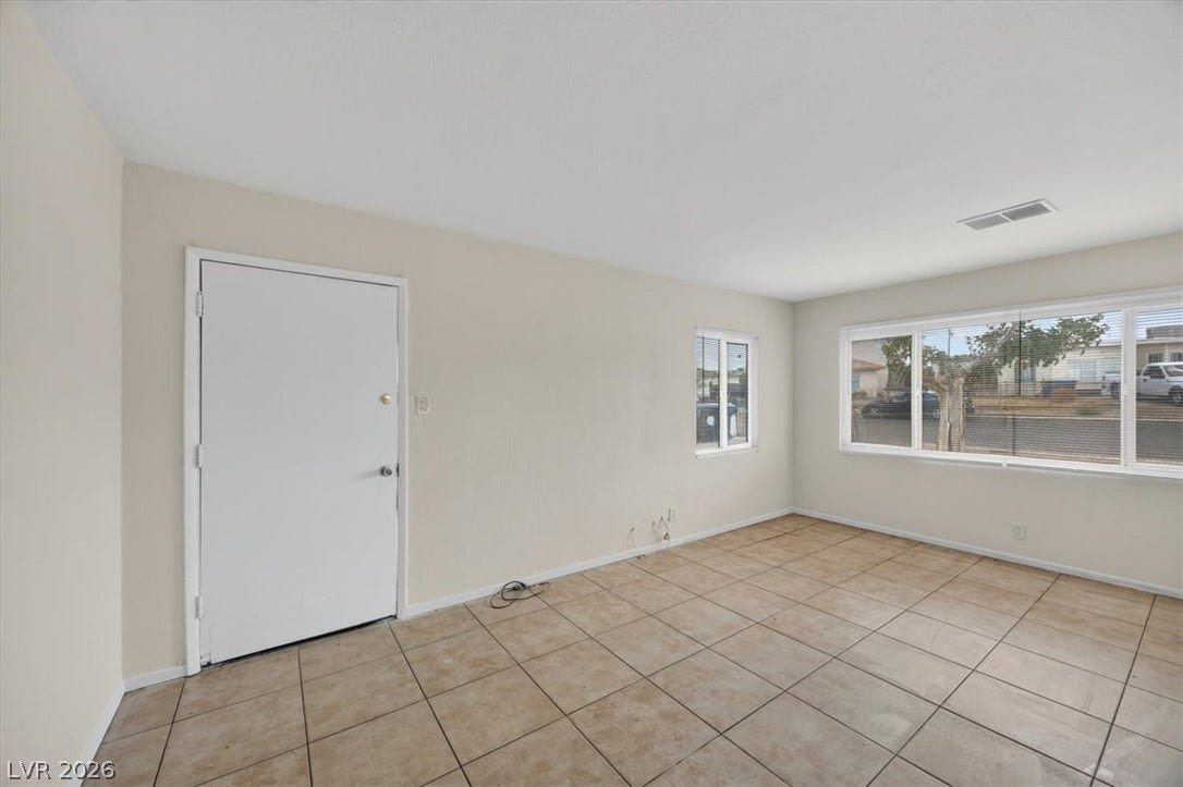 120 W Victory Road, Henderson, NV 89015 Tiled flooring and large windows create a functional entry space.