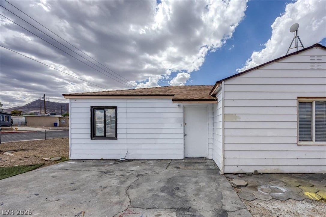 120 W Victory Road, Henderson, NV 89015 Classic siding and durable shingle roofing define this solid exterior structure.