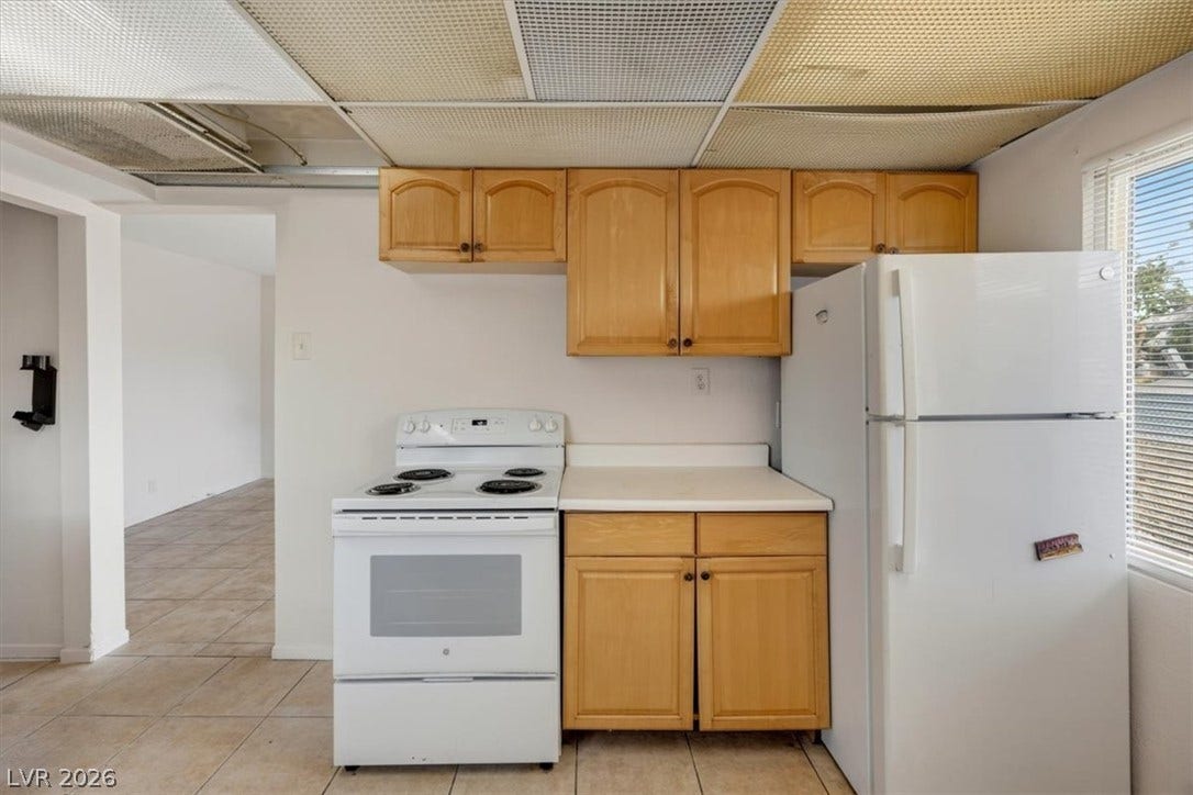 120 W Victory Road, Henderson, NV 89015 Functional kitchen design showcases classic wood cabinets and durable tile flooring.
