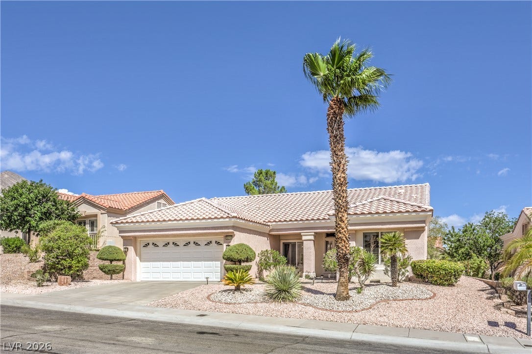 10700 Grand Cypress Avenue, Las Vegas, NV 89134 Desert landscaping and a tiled roof enhance this elegant single-story home.