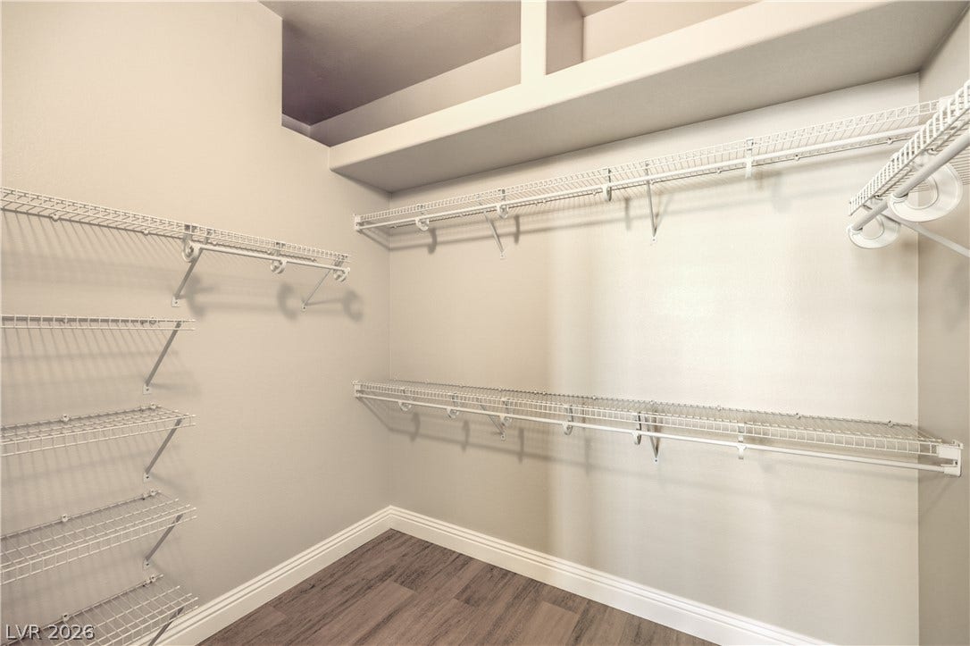 10700 Grand Cypress Avenue, Las Vegas, NV 89134 Ample wire shelving and built-in overhead ledges maximize storage in this wood-floored closet.