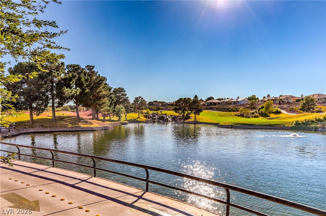 10700 Grand Cypress Avenue, Las Vegas, NV 89134 Serene water views extend across the manicured green of the adjacent golf course.