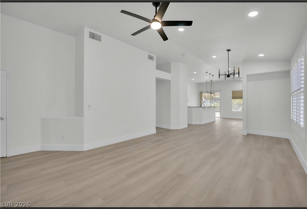 3027 Panorama Ridge Drive, Henderson, NV 89052 An open layout connects the living areas across seamless light wood flooring.