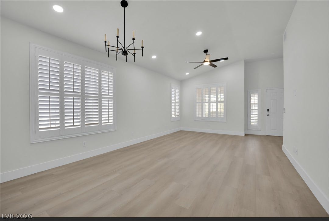 3027 Panorama Ridge Drive, Henderson, NV 89052 Gleaming hardwood floors run through a spacious living area detailed with plantation shutters.