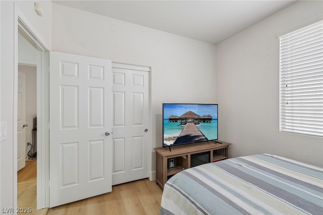 3027 Panorama Ridge Drive, Henderson, NV 89052 Warm wood-like flooring and clean white walls create a serene and inviting atmosphere.