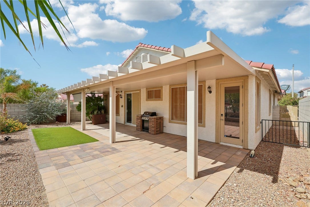 3027 Panorama Ridge Drive, Henderson, NV 89052 A spacious tiled patio sits under a protective covered patio.