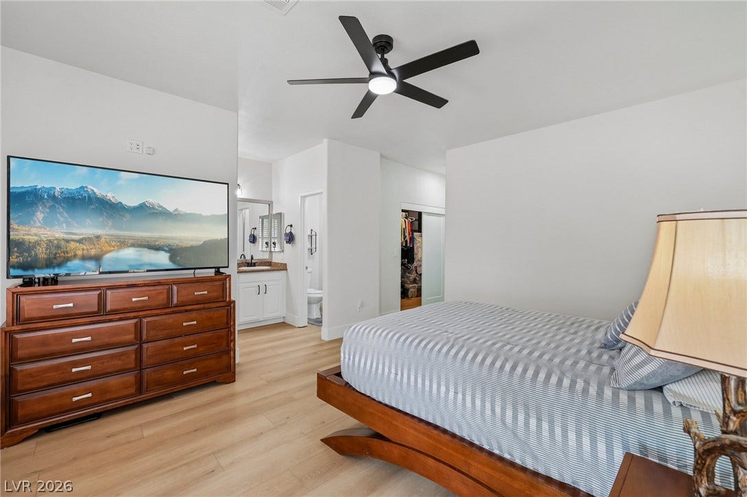 3027 Panorama Ridge Drive, Henderson, NV 89052 Smooth wood -like floors and pristine plaster walls define this relaxing, modern sleeping sanctuary.