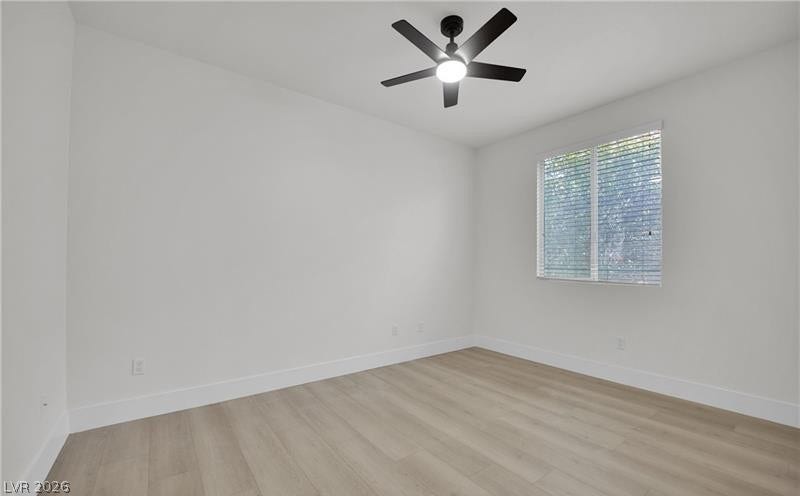 3027 Panorama Ridge Drive, Henderson, NV 89052 Crisp walls and smooth wood-style flooring create a clean slate in this versatile room.