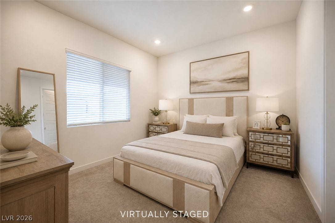 3904 Aiden Creek Avenue, North Las Vegas, NV 89031 Recessed lighting and soft carpeting create a peaceful atmosphere in this cozy bedroom.