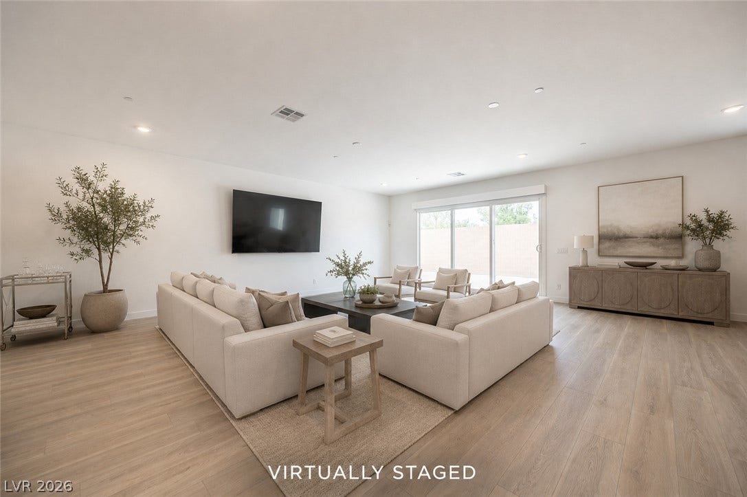3904 Aiden Creek Avenue, North Las Vegas, NV 89031 Recessed lighting and warm wood flooring enhance this airy, modern living space.