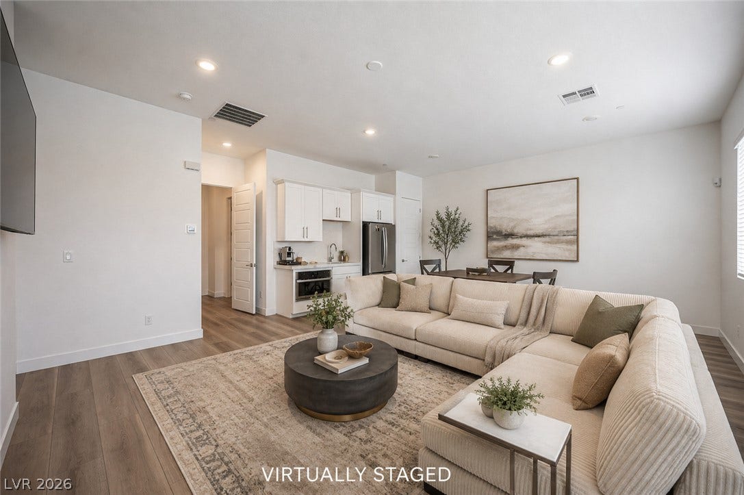 3904 Aiden Creek Avenue, North Las Vegas, NV 89031 Recessed lighting illuminates an airy open layout connecting the main living spaces.