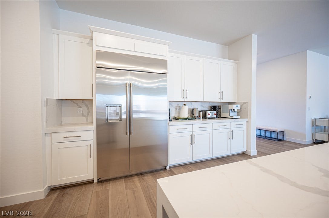 3904 Aiden Creek Avenue, North Las Vegas, NV 89031 Sleek cabinetry and stone countertops anchor this modern culinary space.